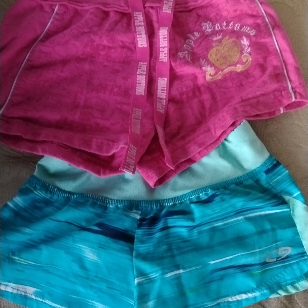 Kids pink apple bottom shorts and a little pill turquoise pair of shorts